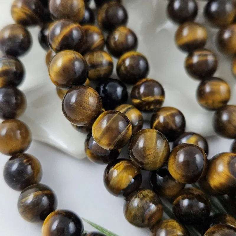 Нить 18 см Тигровый глаз ок. 10 мм гладкие круглые бусины (1002-10) купить в Воронеже | Заказать в интернет-магазине Viva Beads
