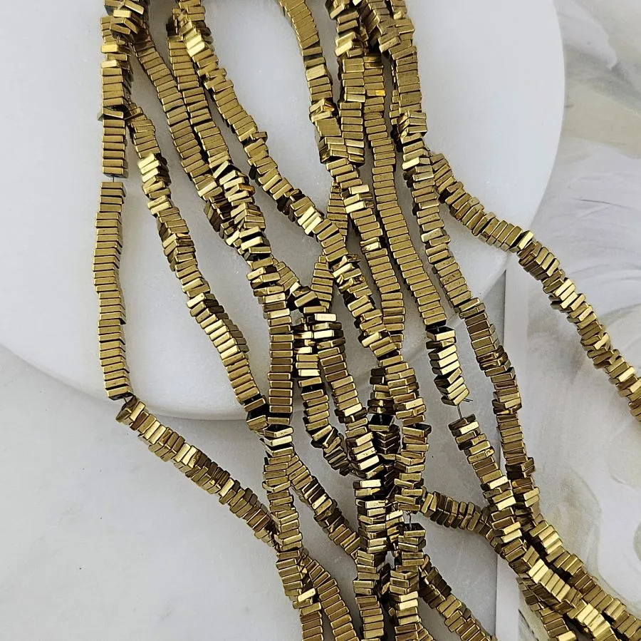 Нить 40 см Гематит, гематин ок. 3х0.9 мм бусины плоский квадрат, цвет античное золото (7896-3) для бижутерии купить с доставкой по России | Интернет‑магазин Viva Beads
