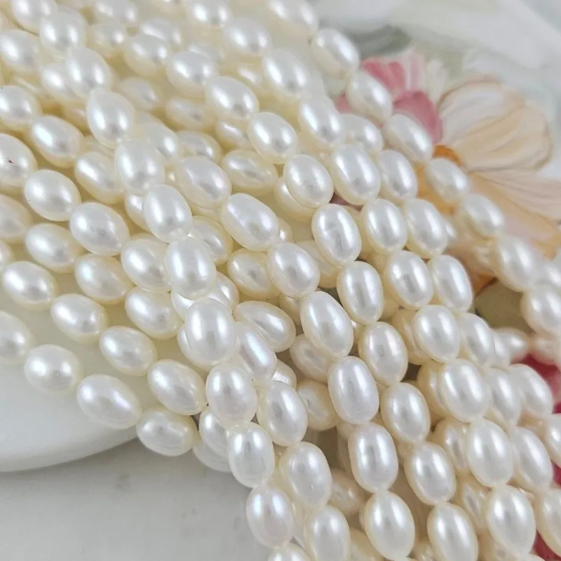 Нить 18 см Жемчуг натуральный речной рис 6-6.3х8.5-10 мм, белый АА (5582) купить с доставкой по России | Интернет-магазин Viva Beads