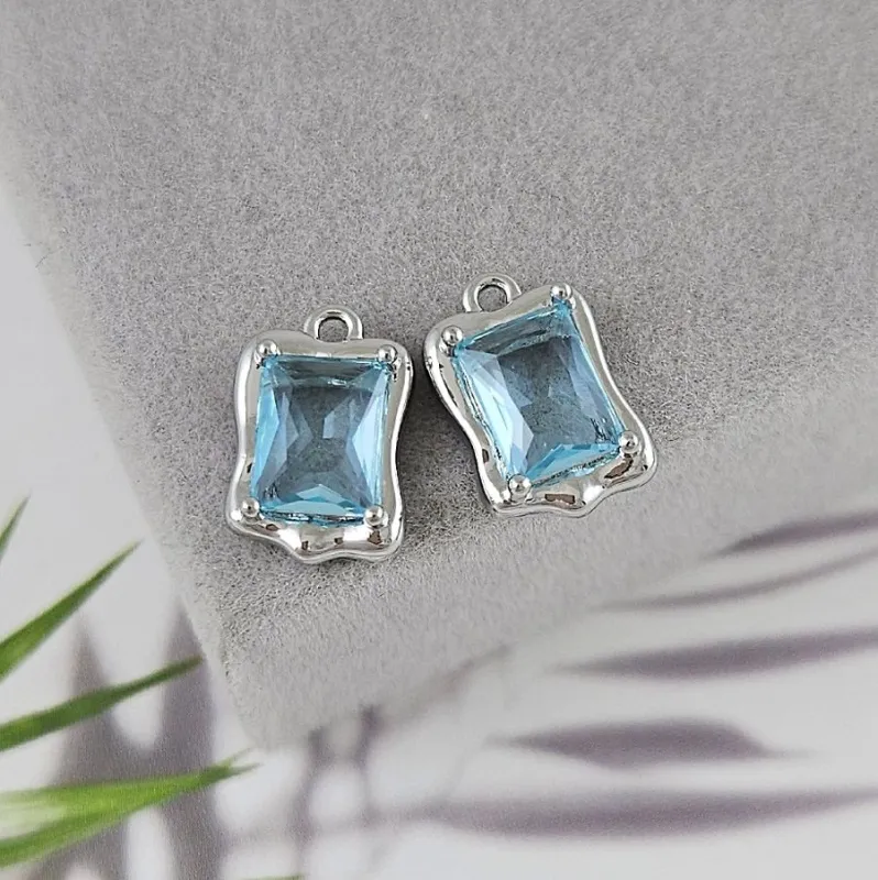 Подвеска с ювелирным стеклом 13.7х9 мм голубой, родиевое покрытие (8738-ГР)