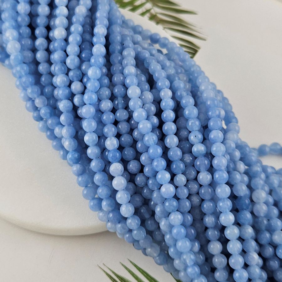 Нить 38 см Кварц тонированный 6-6.5 мм гладкие бусины, голубой  (10026-6) купить в Воронеже | Заказать в интернет-магазине Viva Beads

