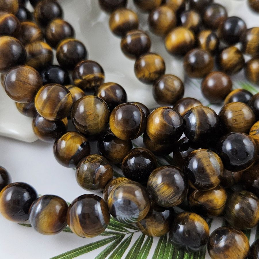 Нить 18 см Тигровый глаз ок. 10 мм гладкие круглые бусины (1002-10) купить в Воронеже | Заказать в интернет-магазине Viva Beads
