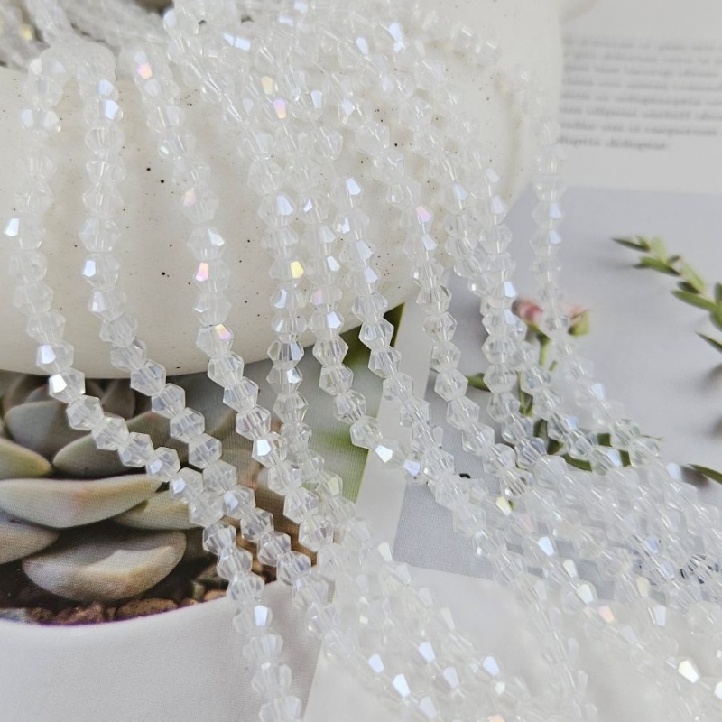 Нить 32 см Хрустальные бусины биконус 3.8х4.5 мм прозрачный АВ (8462-4-ПРОЗАВ) купить в Воронеже | Заказать в интернет-магазине Viva Beads
 Нить 32 см Хрустальные бусины биконус 3.8х4.5 мм прозрачный АВ (8462-4-ПРОЗАВ) купить в Воронеже  | Заказать в интернет-магазине Viva Beads